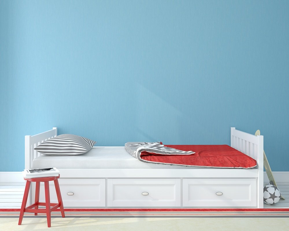 A kid’s bed with built-in storage space